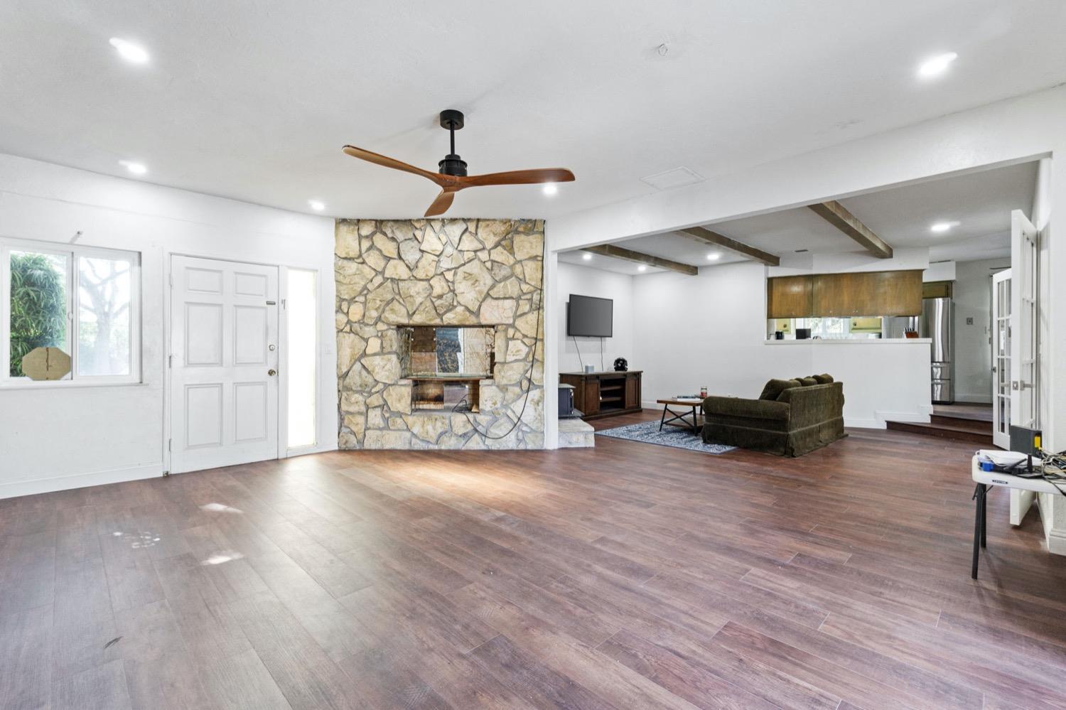 5654 North 7th Street Fresno, CA 93710 - Photo 17 of 38 a view of a livingroom with furniture and a flat screen tv