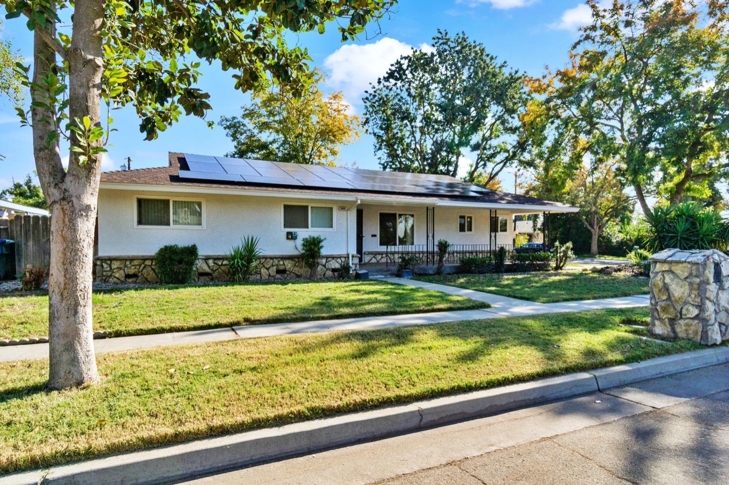 5654 North 7th Street Fresno, CA 93710 - Photo 2 of 38 a view of a house with a yard patio and swimming pool