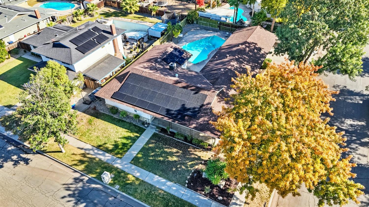 5654 North 7th Street Fresno, CA 93710 - Photo 35 of 38 an aerial view of a house with a yard and garden