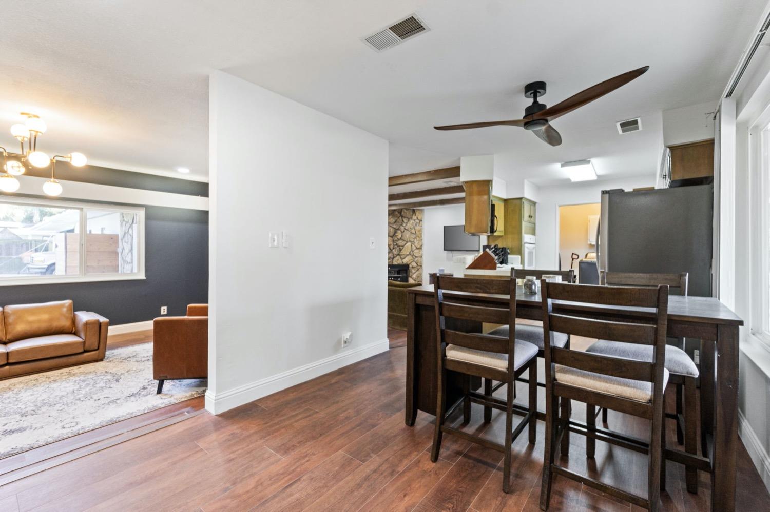 5654 North 7th Street Fresno, CA 93710 - Photo 6 of 38 a view of a dining room with furniture and a window