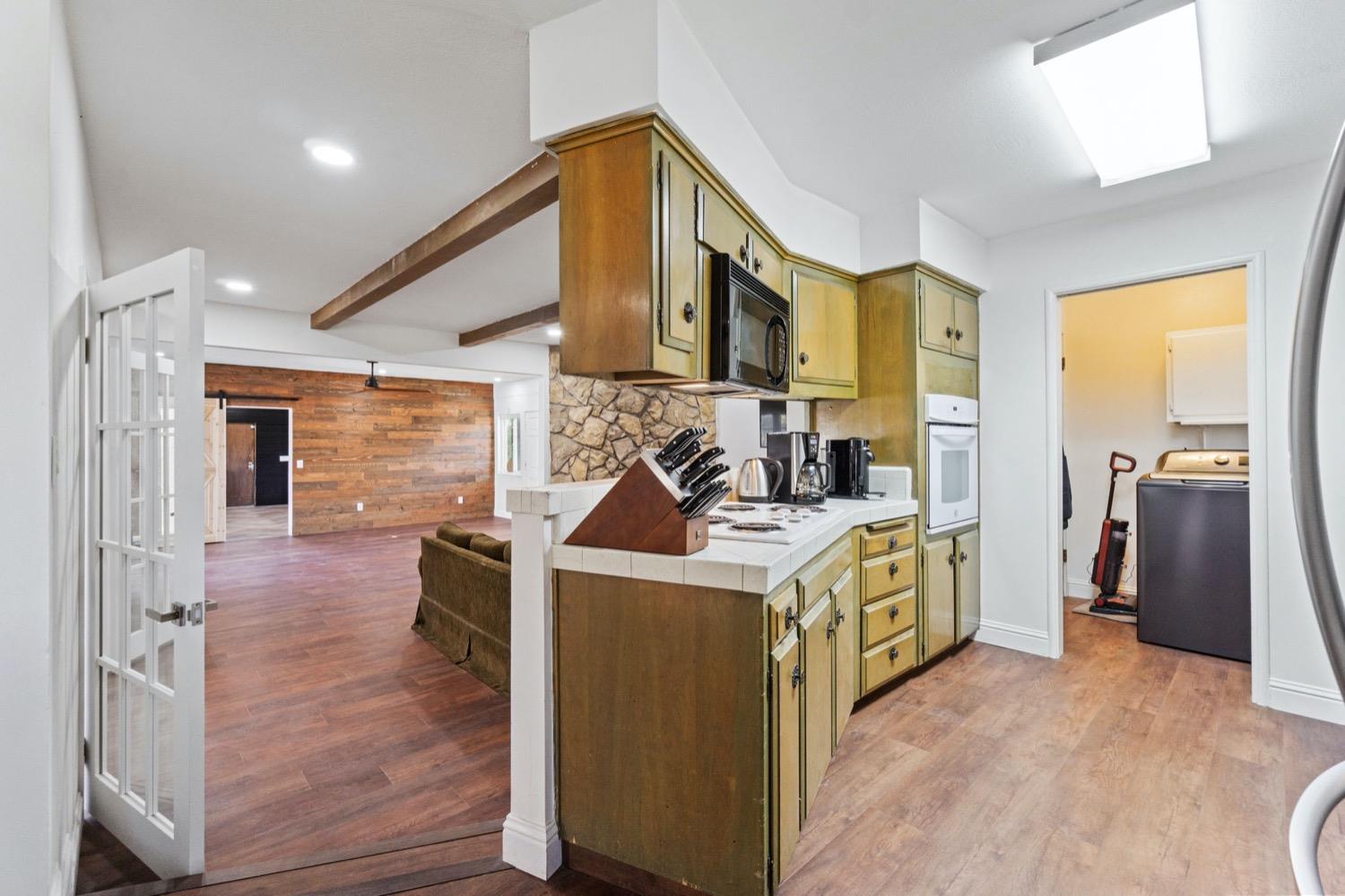 5654 North 7th Street Fresno, CA 93710 - Photo 10 of 38 a kitchen that has a sink and a stove in it