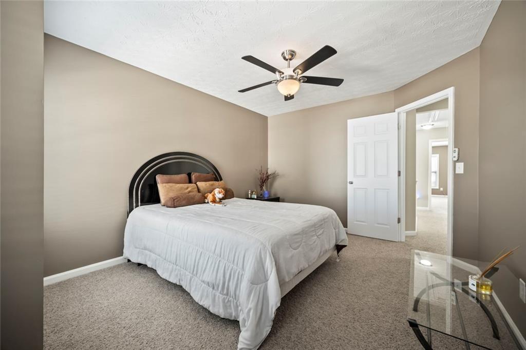 6066 Allpoint Way Fairburn, GA 30213 - Photo 26 of 43 a bedroom with a bed and window