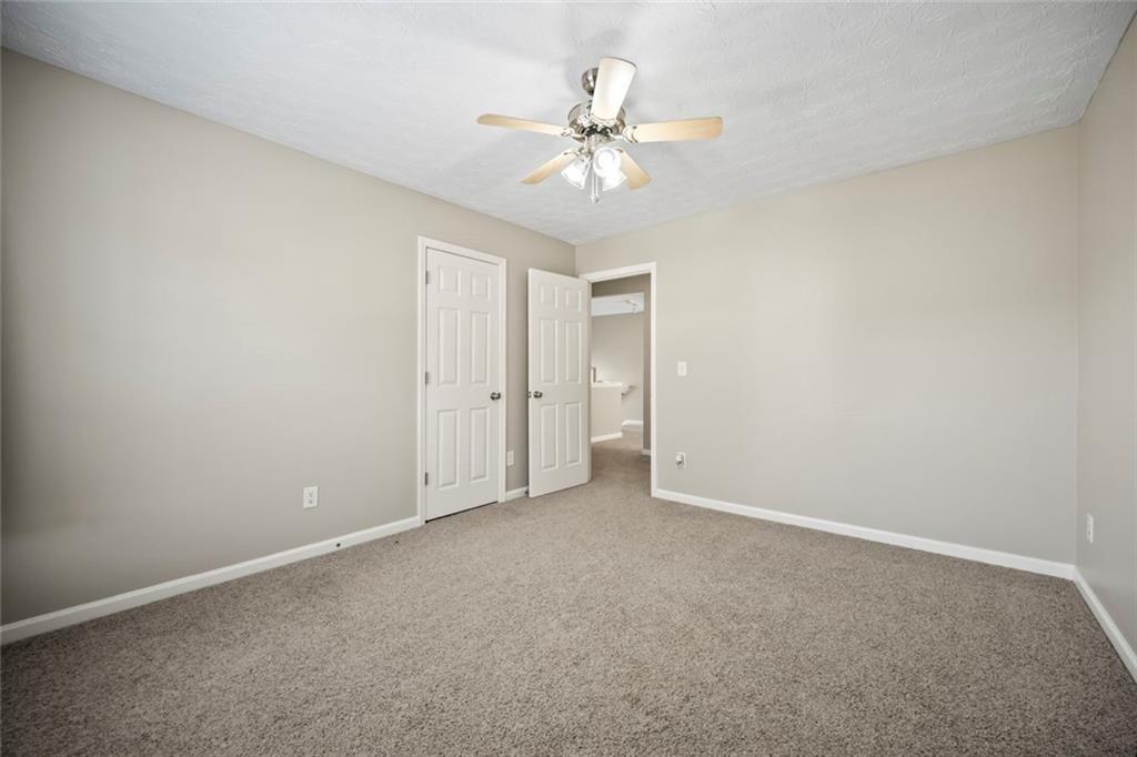 6066 Allpoint Way Fairburn, GA 30213 - Photo 28 of 43 a view of an empty room with a fan
