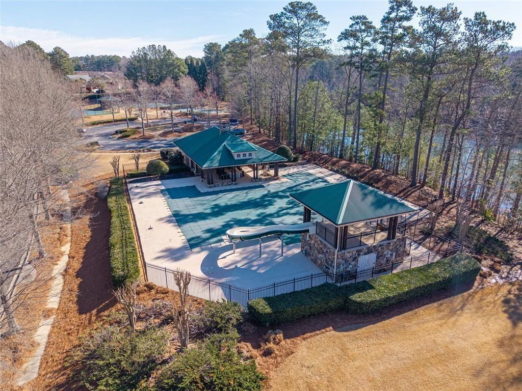 6066 Allpoint Way Fairburn, GA 30213 - Photo 6 of 43 an aerial view of a house with a yard and lake view