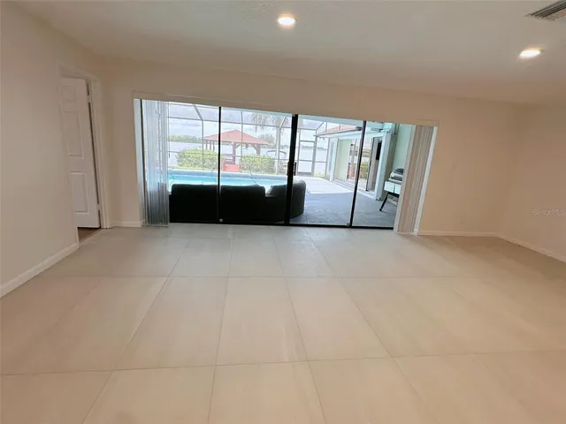 a view of an empty room with a fireplace