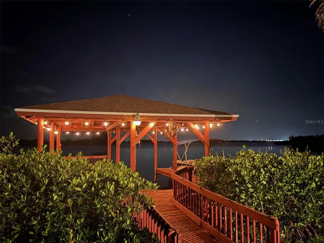 a view of a swimming pool with outdoor seating