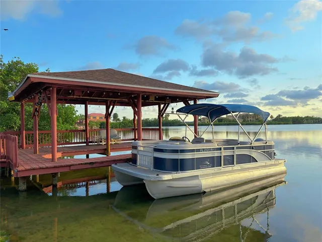 a view of a swimming pool with outdoor seating
