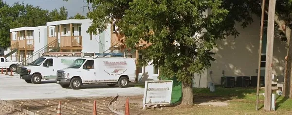 a view of a backyard with large trees