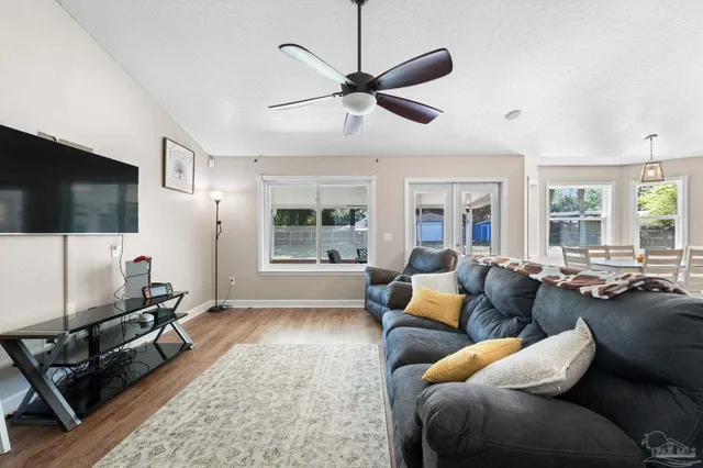 a kitchen with stainless steel appliances a refrigerator and a stove top oven