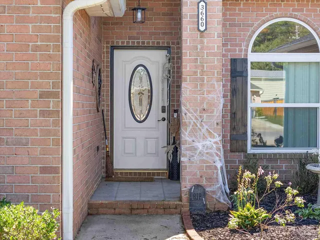 a living room with furniture fireplace and flat screen tv