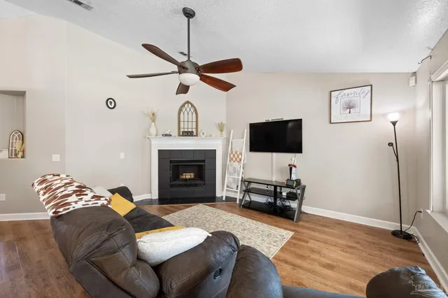 a white kitchen with granite countertop white cabinets and white appliances