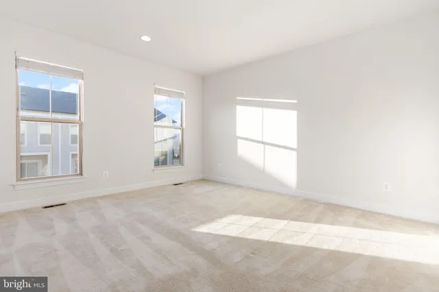 an empty room with windows