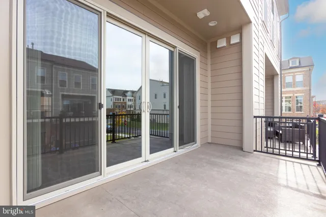a view of an entryway with a floor to ceiling window