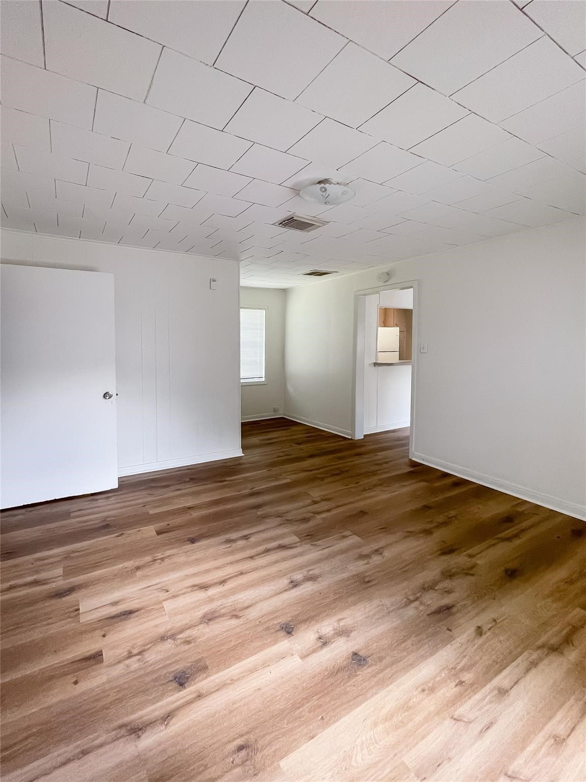 1241 Chevy Chase Drive Angleton, TX 77515 - Photo 9 of 21 a view of empty room with wooden floor