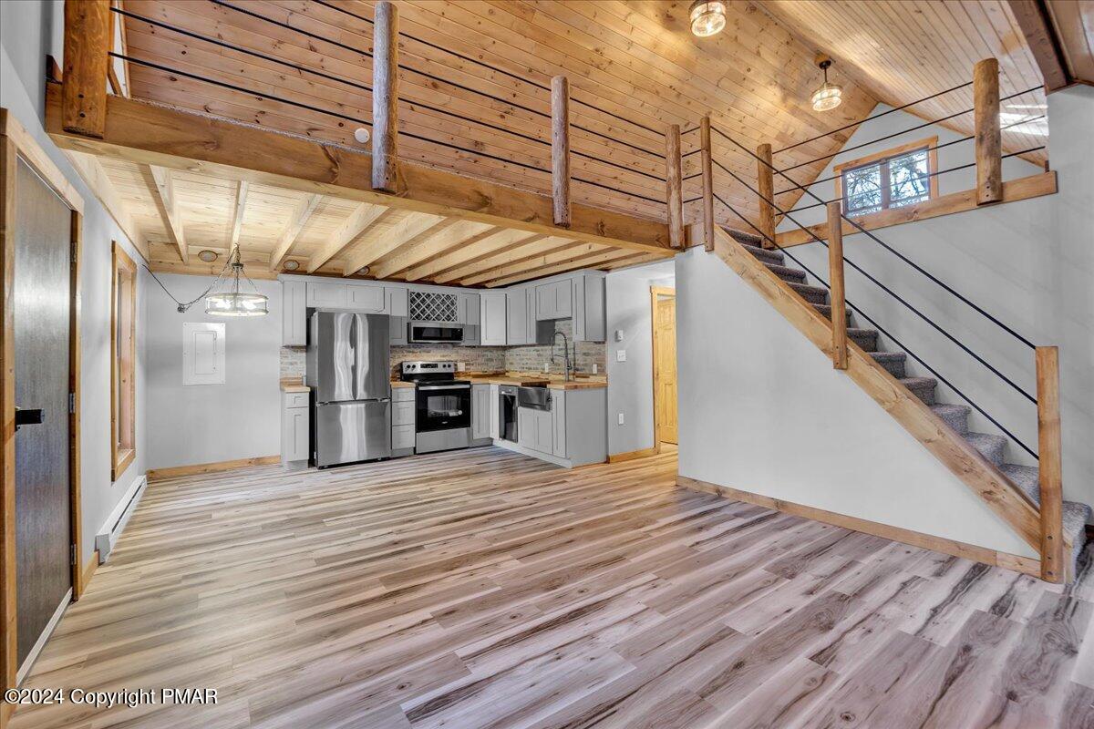 235 Bird Lane Kunkletown, PA 18058 - Photo 11 of 33 a view of kitchen with stainless steel appliances wooden floor and staircase