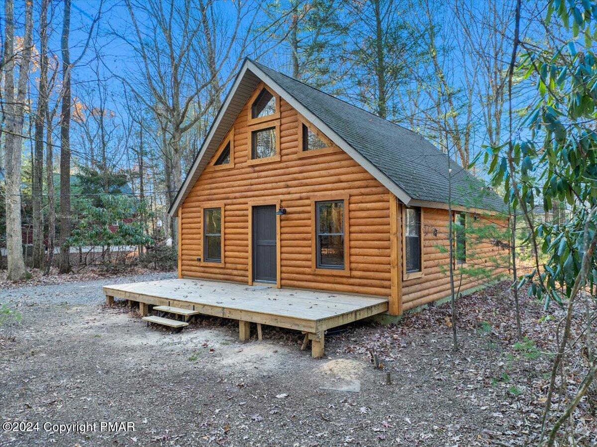 235 Bird Lane Kunkletown, PA 18058 - Photo 26 of 33 a backyard of a house with wooden fence and deck