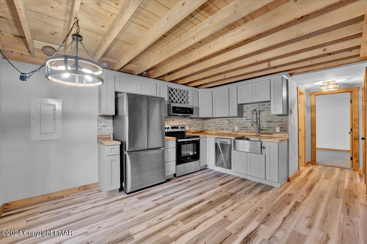 235 Bird Lane Kunkletown, PA 18058 - Photo 4 of 33 a kitchen with stainless steel appliances granite countertop a refrigerator a stove a sink dishwasher and a oven with cabinets
