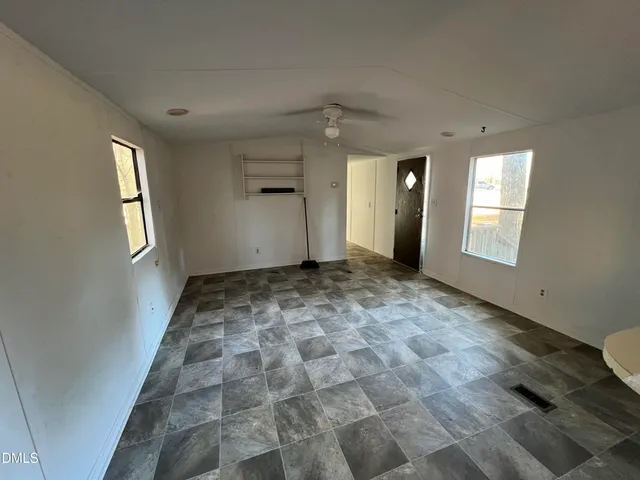 a view of an empty room and window