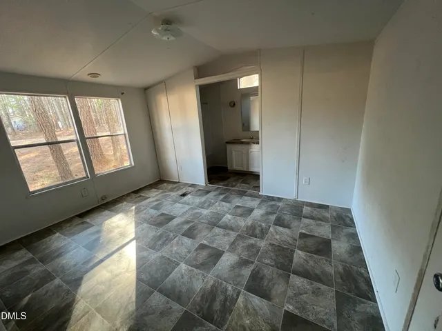 a view of an empty room and window