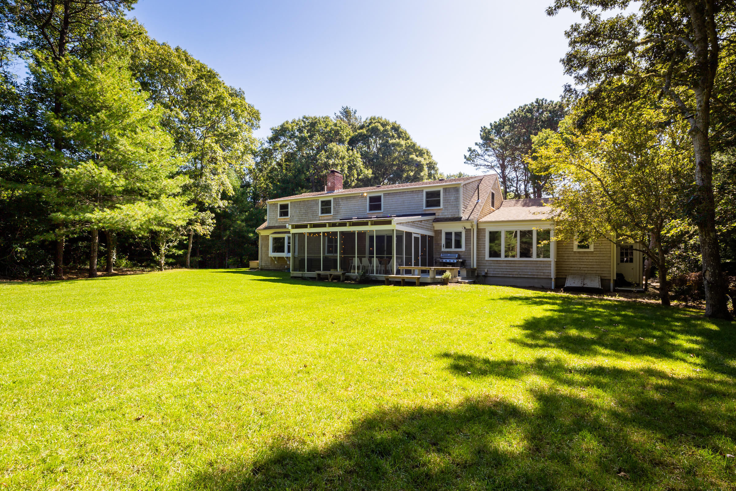 70 Leonard Road Osterville, MA 02655 - Photo 7 of 52 a front view of a house with swimming pool