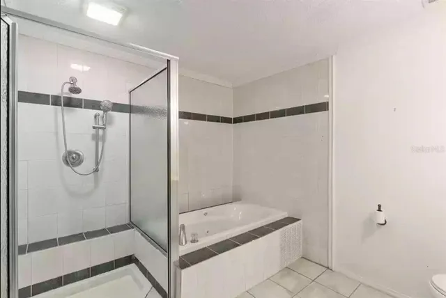 a bathroom with a shower and a sink