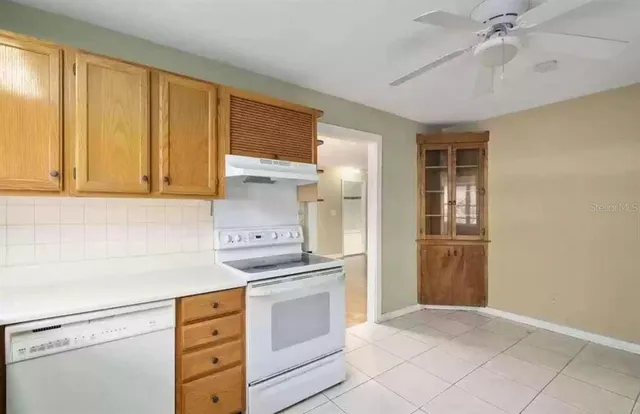 a kitchen with stainless steel appliances a stove and a refrigerator