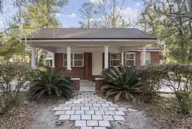 a house view with a garden space