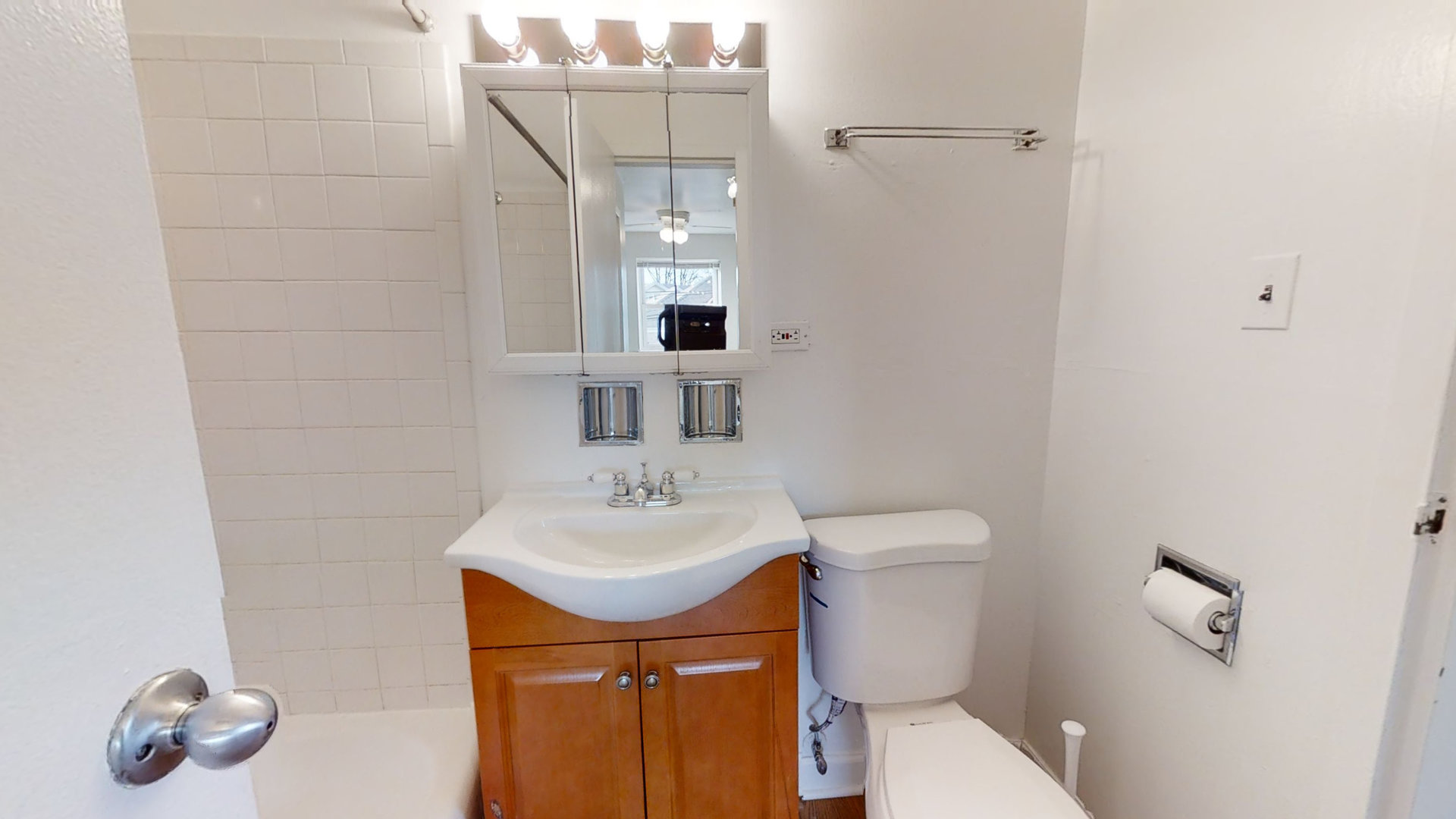 6606 Windsor Avenue, Unit 2A Berwyn, IL 60402 - Photo 12 of 15 a bathroom with a sink toilet and mirror
