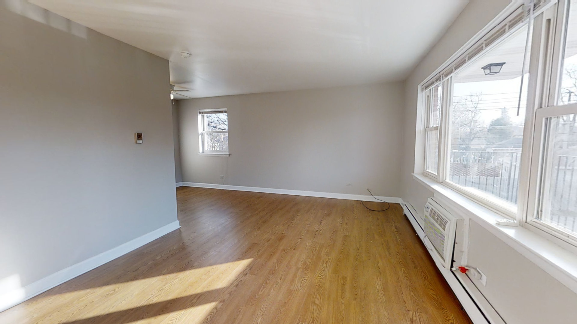 6606 Windsor Avenue, Unit 2A Berwyn, IL 60402 - Photo 15 of 15 a view of an empty room with wooden floor and a window