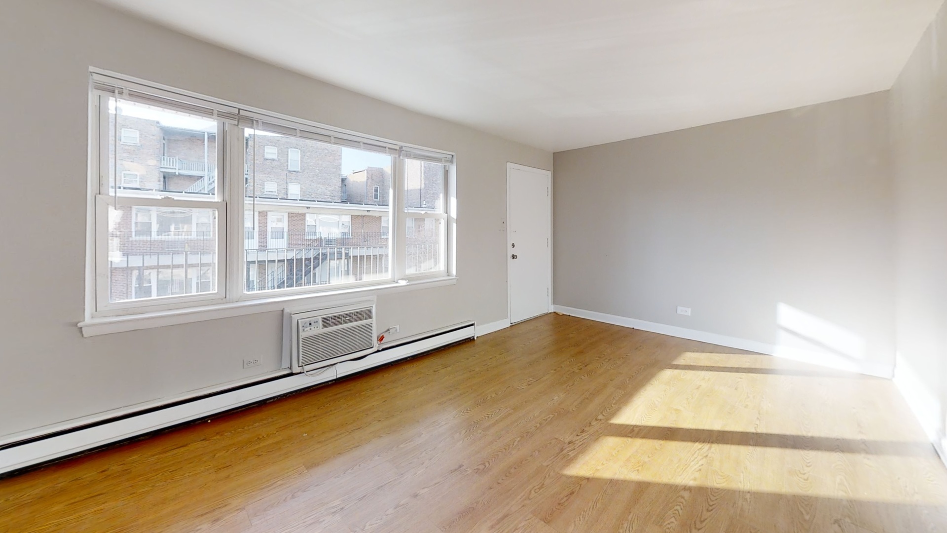 6606 Windsor Avenue, Unit 2A Berwyn, IL 60402 - Photo 2 of 15 a view of an empty room with a window
