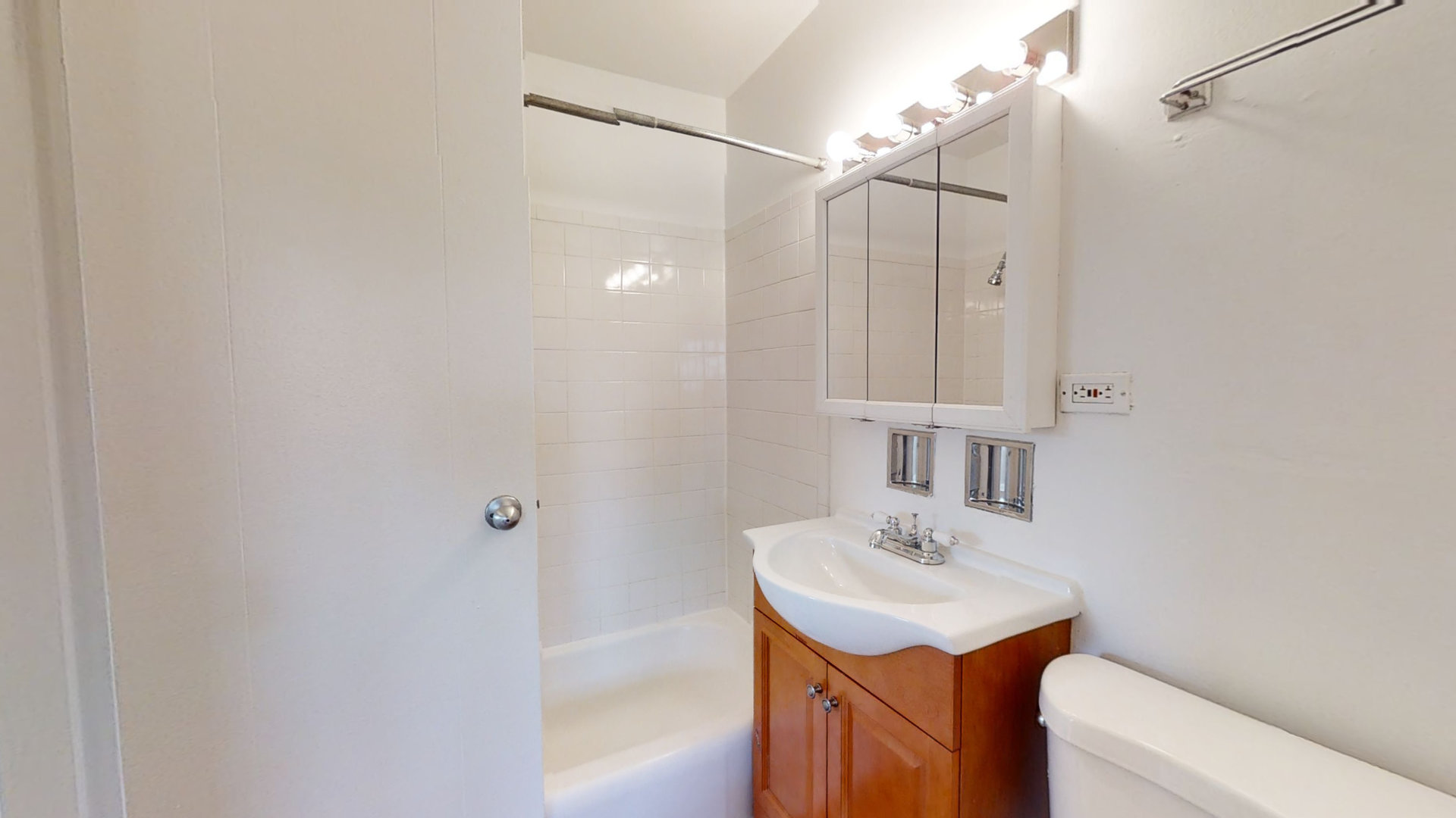 6606 Windsor Avenue, Unit 2A Berwyn, IL 60402 - Photo 9 of 15 a bathroom with a sink a toilet and shower