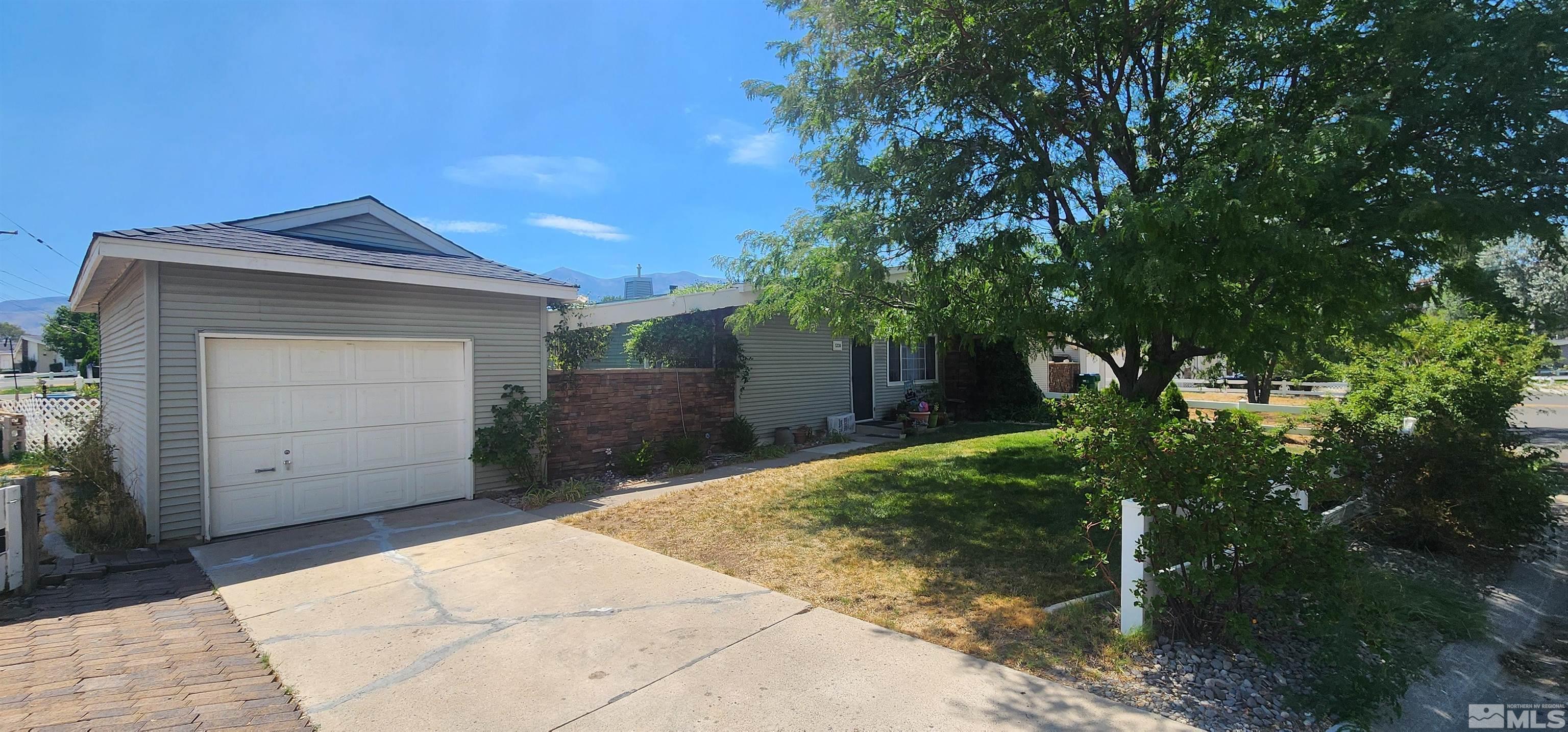 5330 Teton Street Reno, NV 89506 - Photo 2 of 11 a house with trees in front of it
