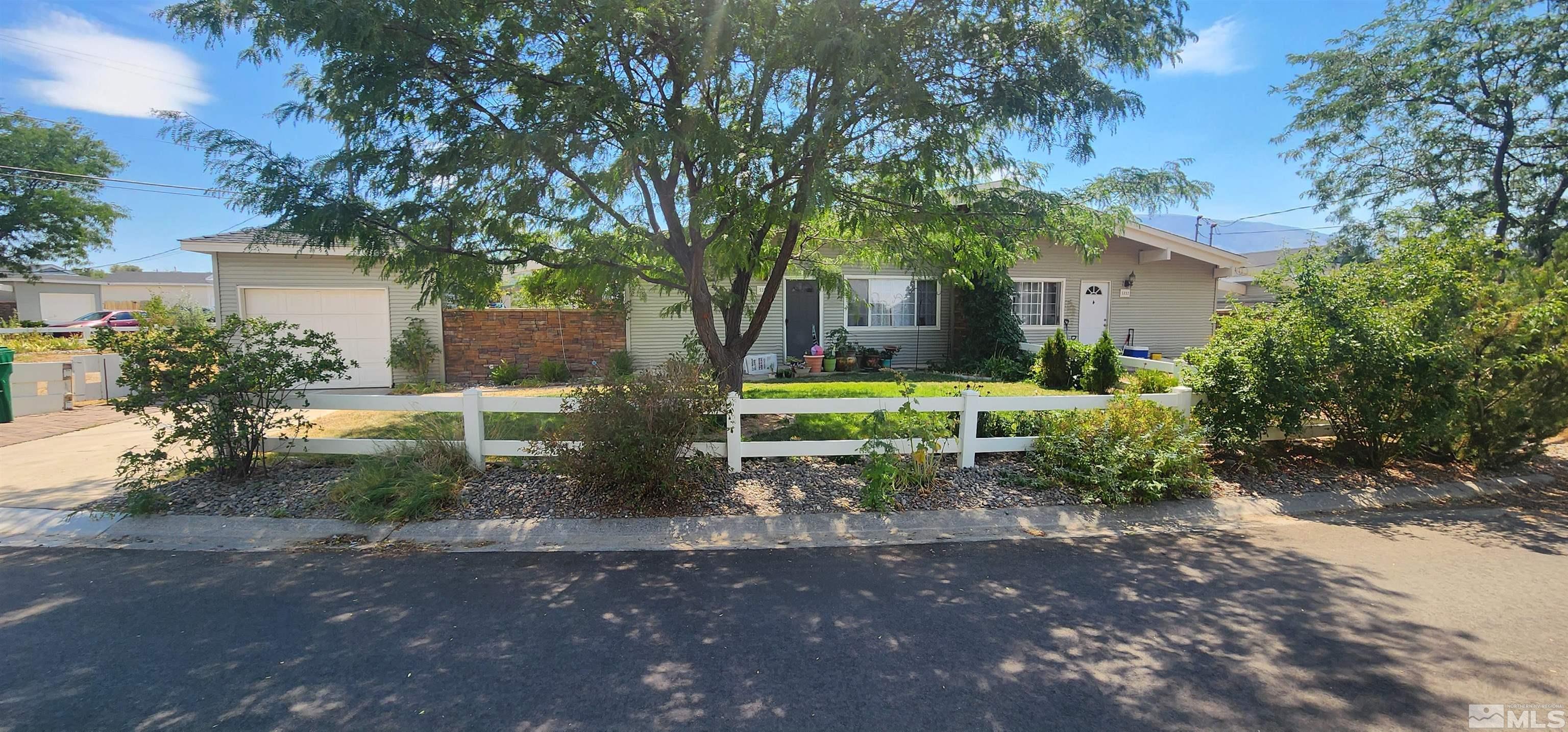 5330 Teton Street Reno, NV 89506 - Photo 3 of 11 a backyard of a house with table and chairs