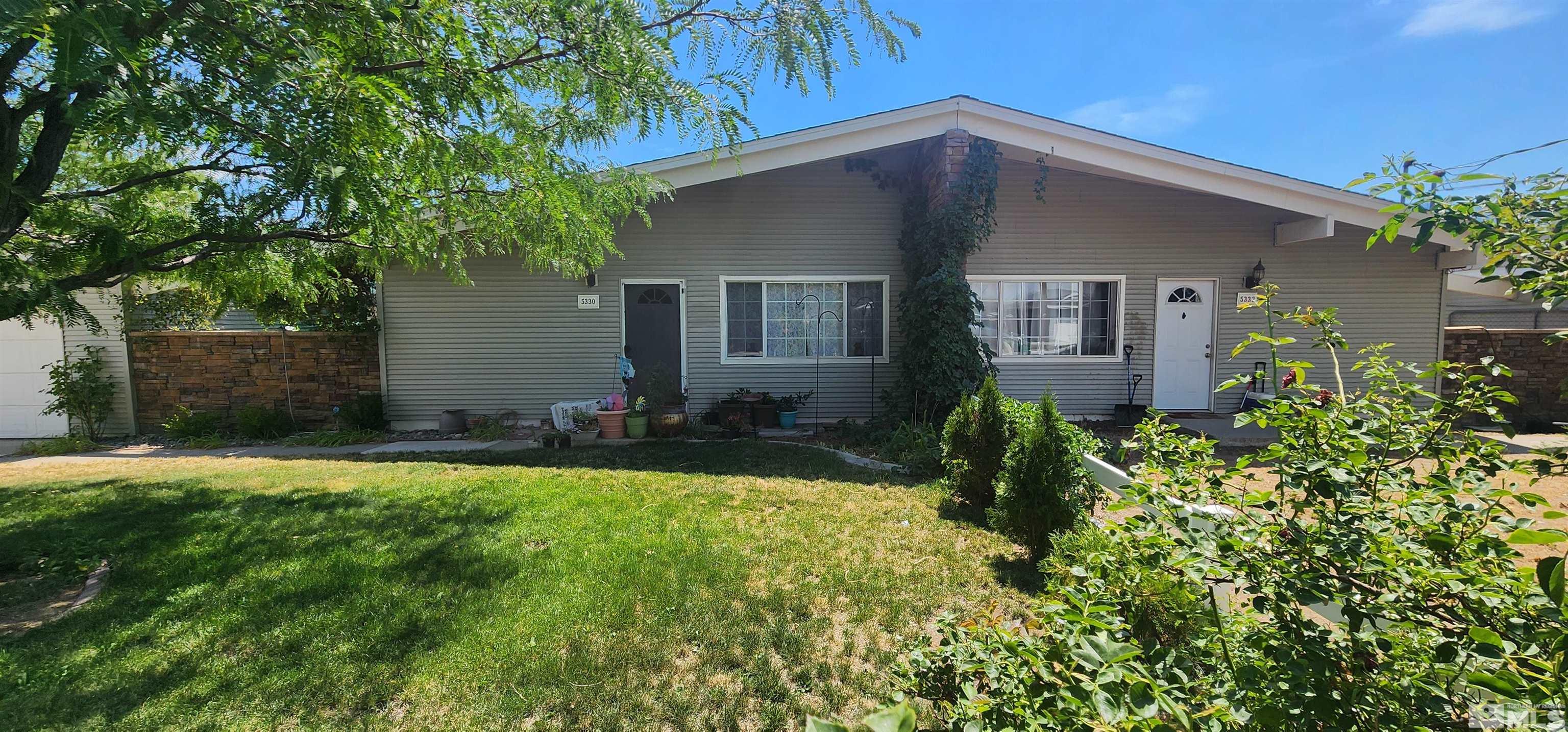 5330 Teton Street Reno, NV 89506 - Photo 4 of 11 a front view of house with yard and trees