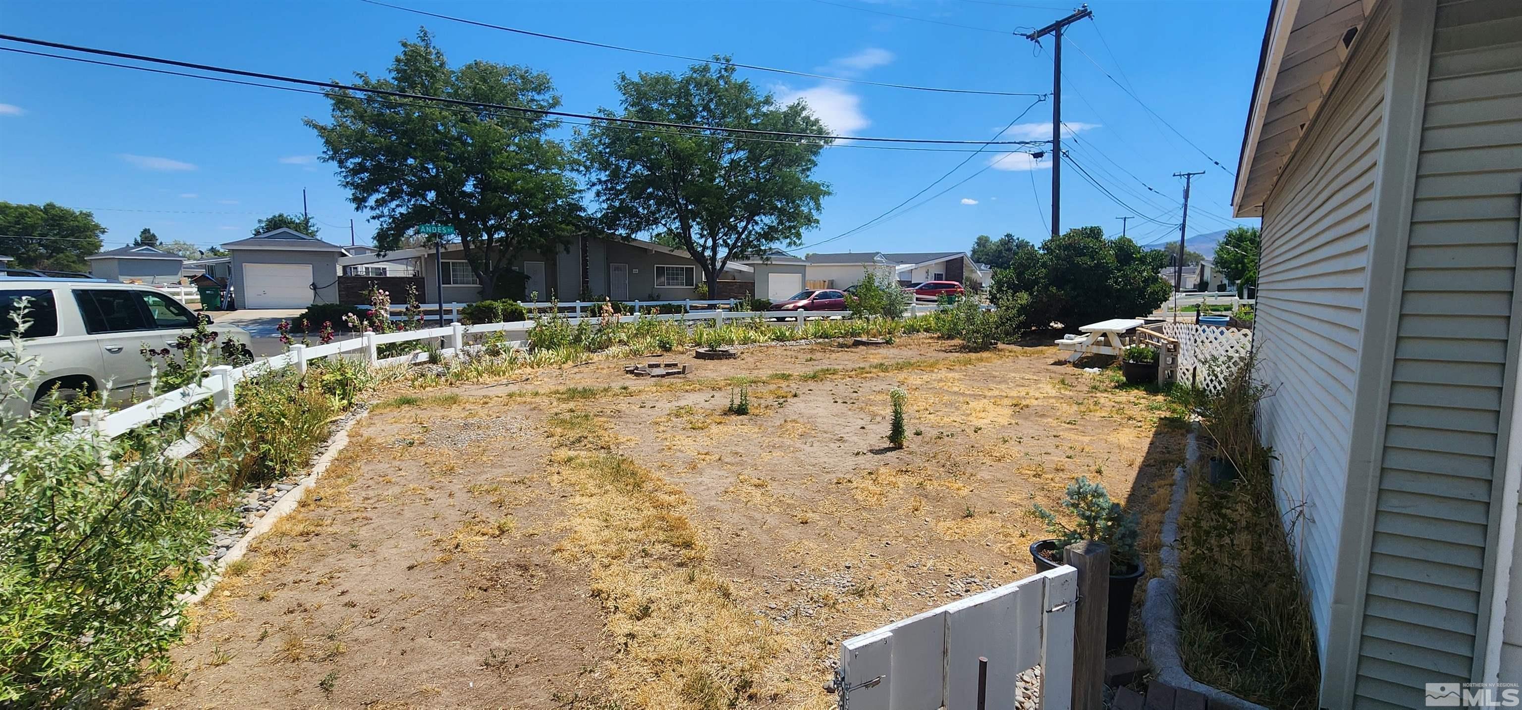 5330 Teton Street Reno, NV 89506 - Photo 6 of 11 a view of a backyard with chairs and potted plants