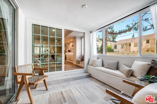 a living room with furniture and windows