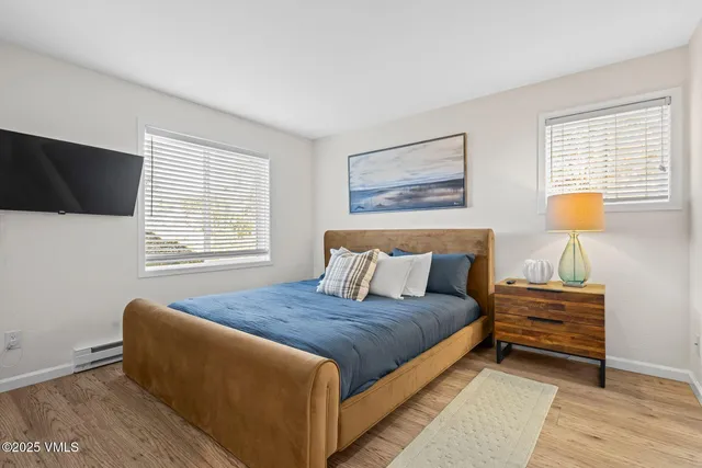 a bedroom with a bed and couch