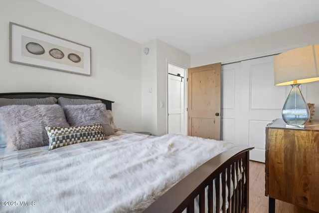 a bedroom with a bed and a table in it