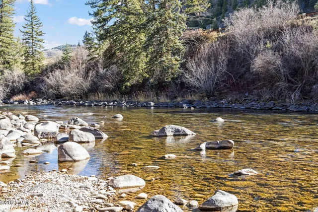 a view of a swimming pool and lounge chair