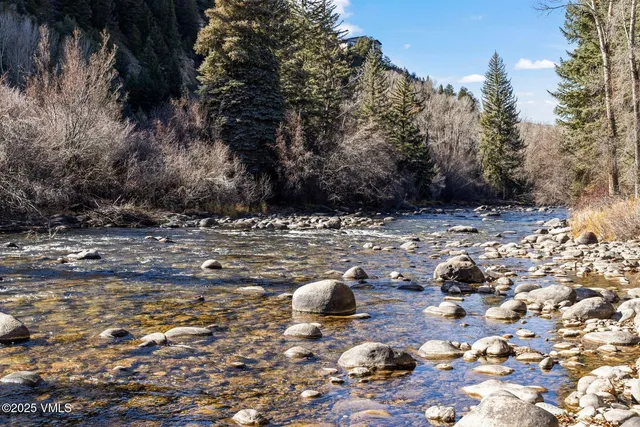 a view of swimming pool with a yard