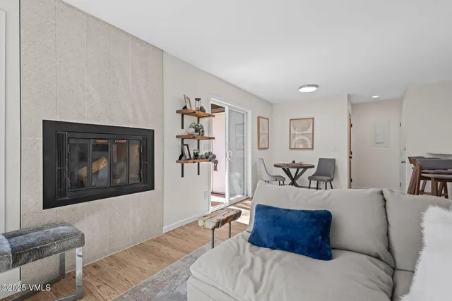 a bedroom with a bed couch and a window