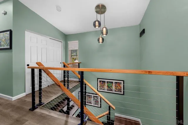 a view of a hallway with staircase