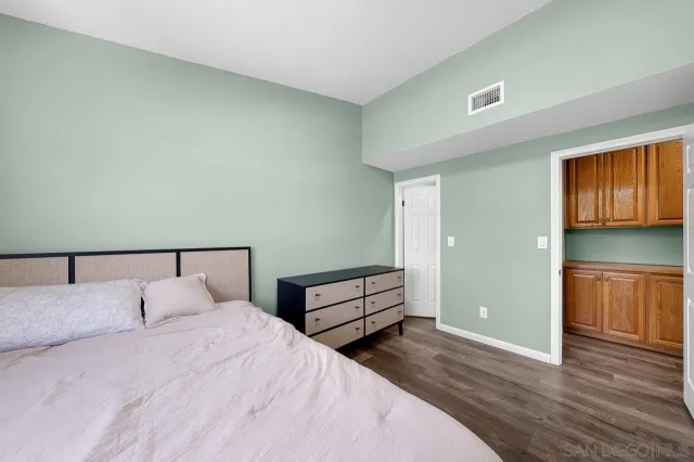 a room with a closet and wooden floor