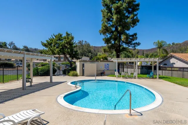 a view of a swimming pool with a patio