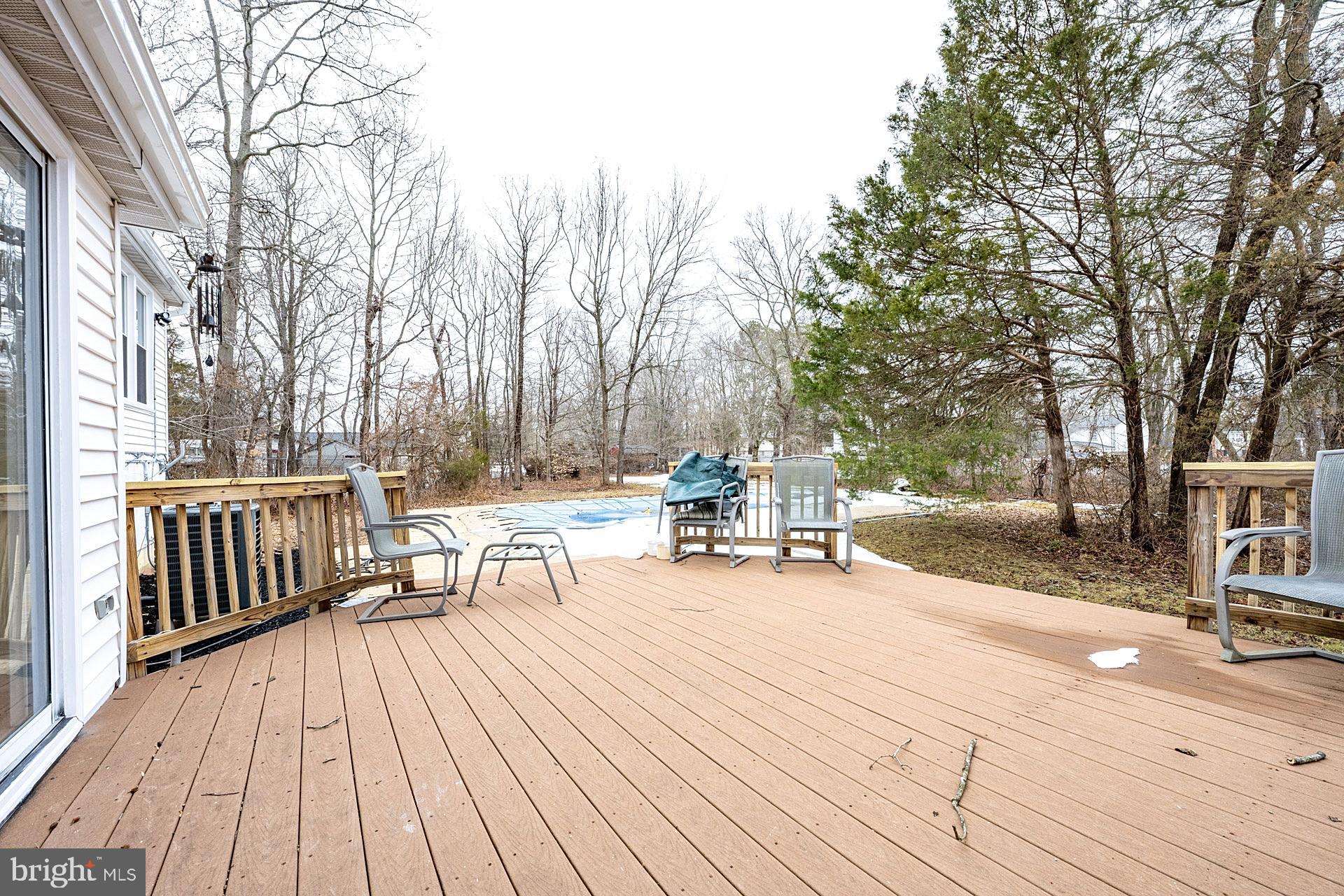 8414 Belding Court Brandywine, MD 20613 - Photo 32 of 37 a view of a patio with a bench and trees