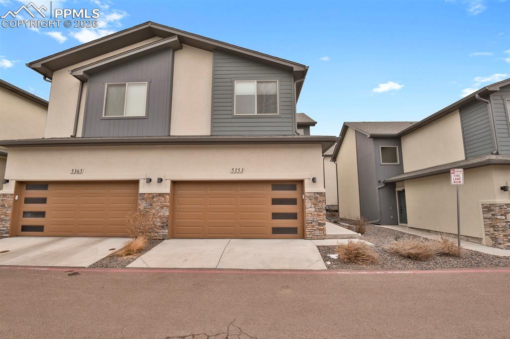5353 Freeboot Point Colorado Springs, CO 80922 - Photo 2 of 28 a house view with a outdoor space
