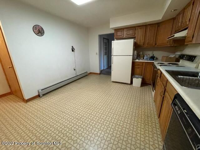 326 Browntown Road Wyalusing, PA 18853 - Photo 8 of 42 a kitchen with a refrigerator a stove top oven a sink and cabinets