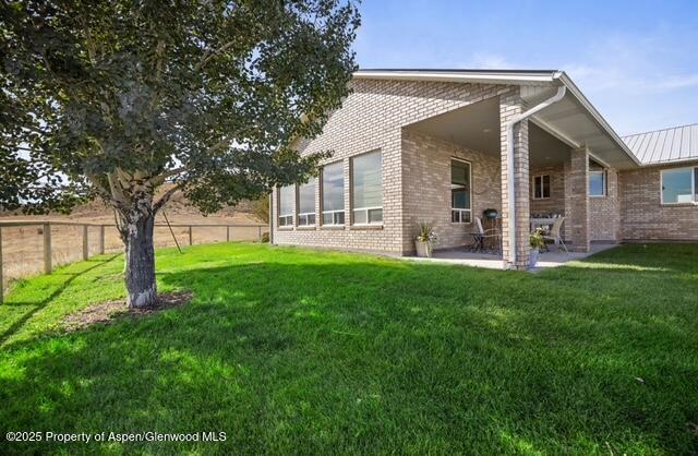 1040 Pronghorn Road Craig, CO 81625 - Photo 13 of 70 a view of a house with a yard