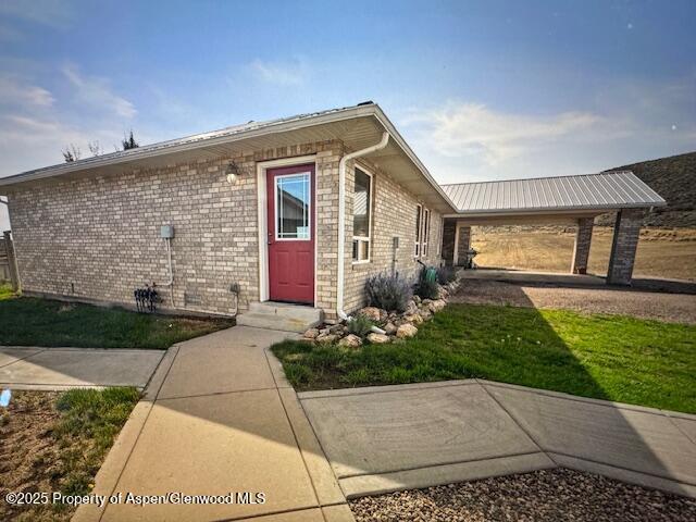 1040 Pronghorn Road Craig, CO 81625 - Photo 15 of 70 a front view of a house with garden