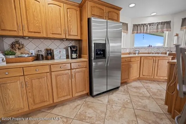 a view of a livingroom with workspace and a window